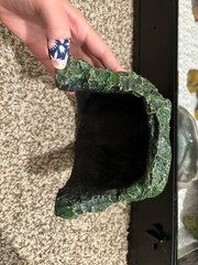 reptile care lot includes hide and food and water dishes
