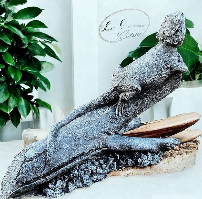 bearded dragon on log life sized concrete statue
